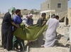 Iraqis in Fallujah bury their dead